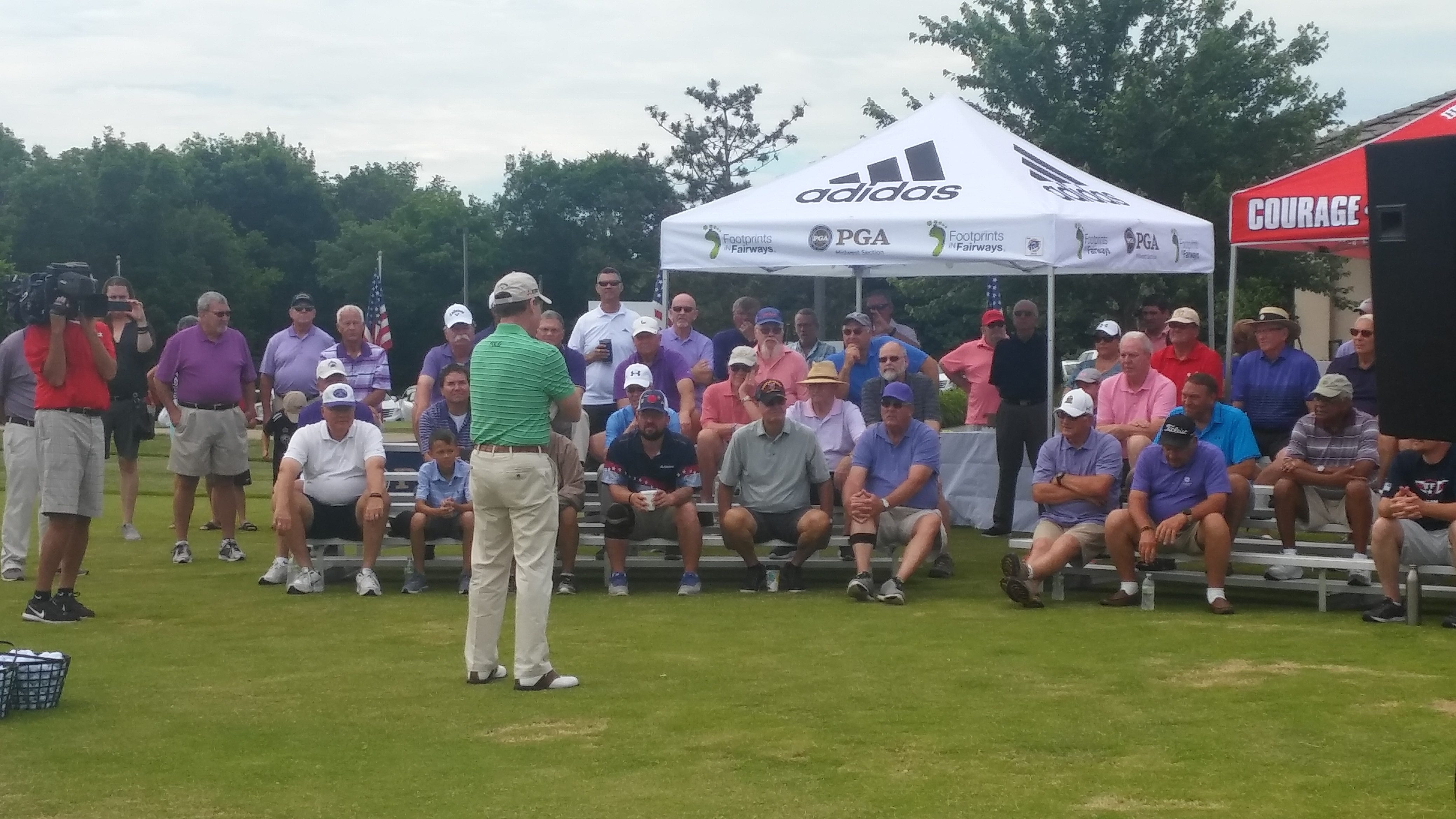 Golfer teaching a crowd
