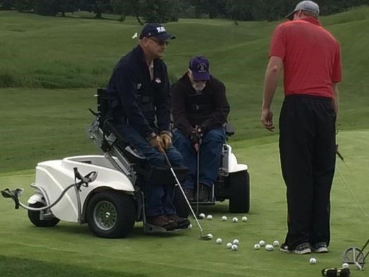 Military heroes playing golf