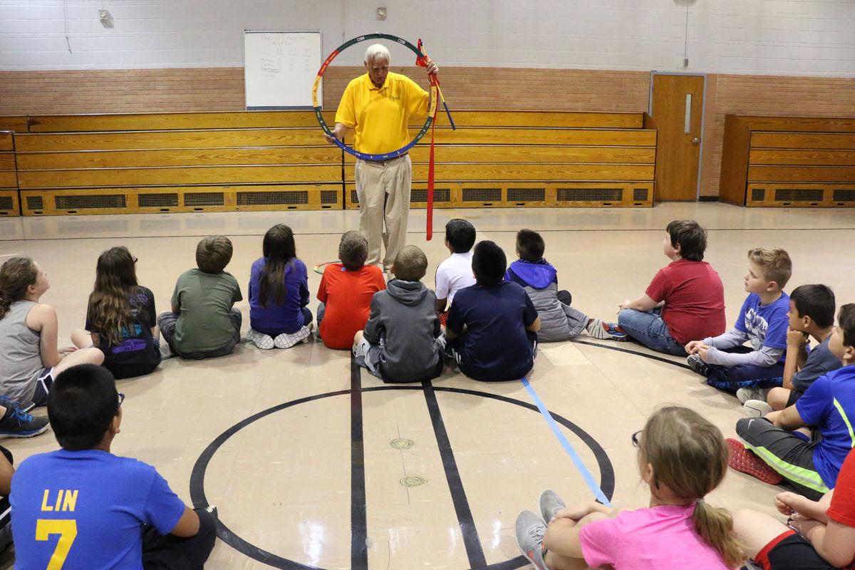 Golfer talking to kids